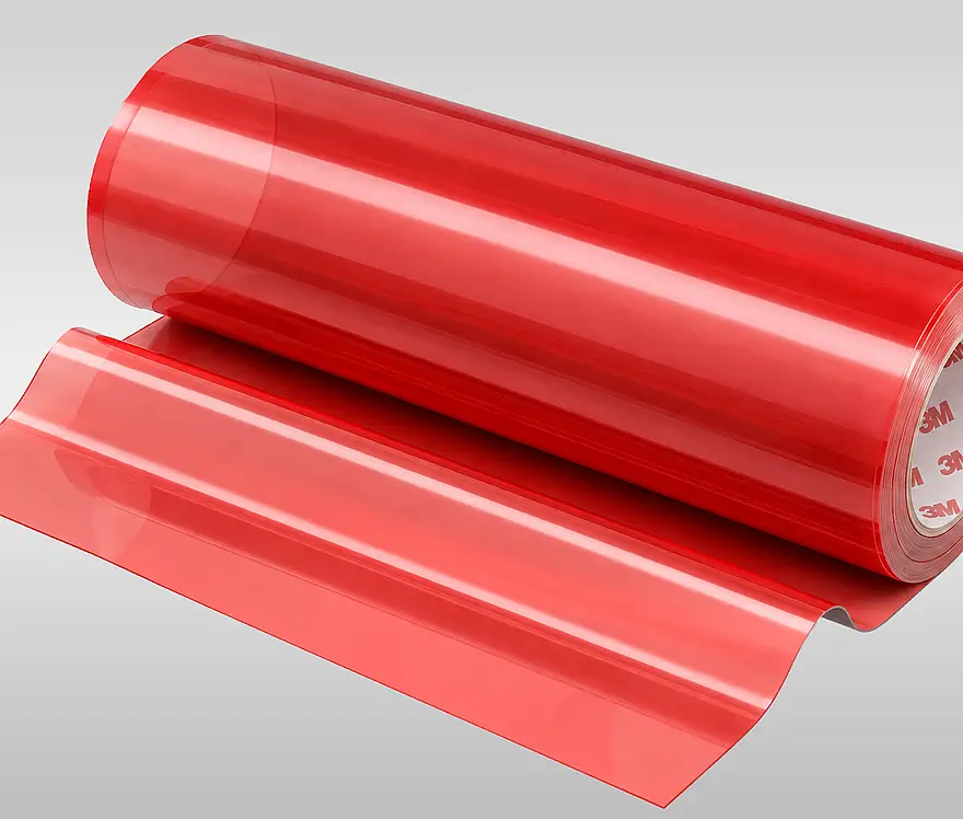 Red roll of 3M film tape with a length of tape unwound