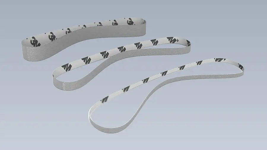 Three narrow closed sanding belts of different lengths