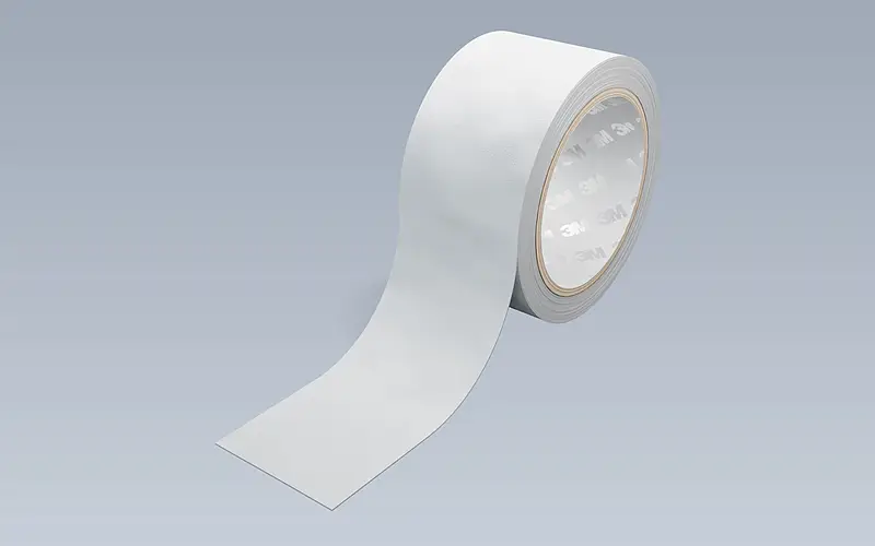 Light-coloured adhesive tape roll used to discuss the required roll dimensions