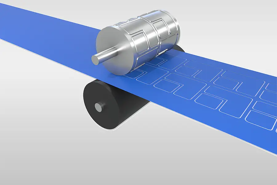 Illustration of a cylindrical die above a continuous material web