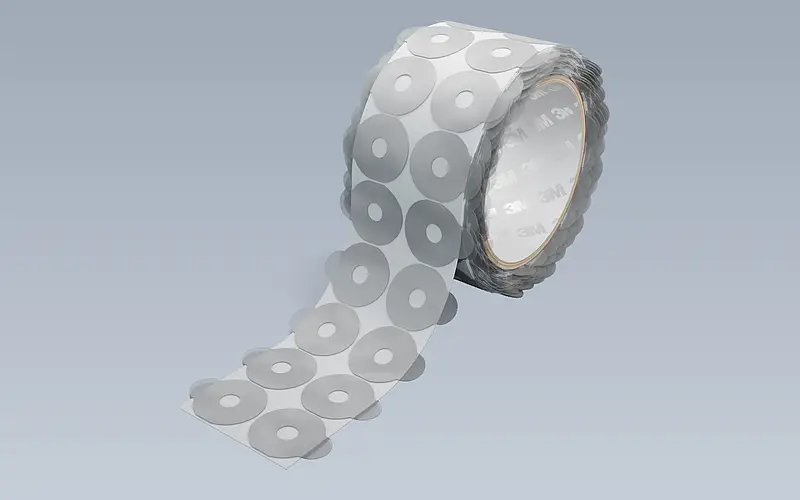 Die-cut parts with pull tabs on a roll