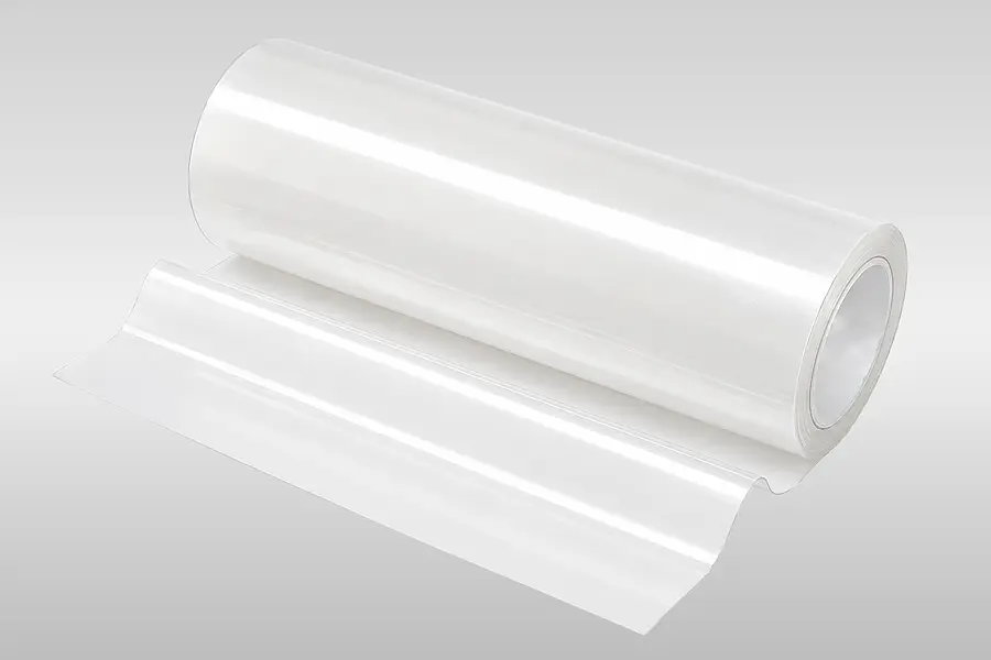 Roll of transparent adhesive film with a section pulled away
