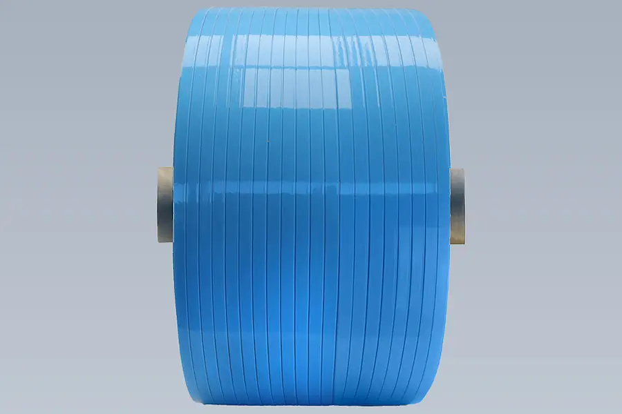 Blue cross-wound spool with several narrow tape layers on a core