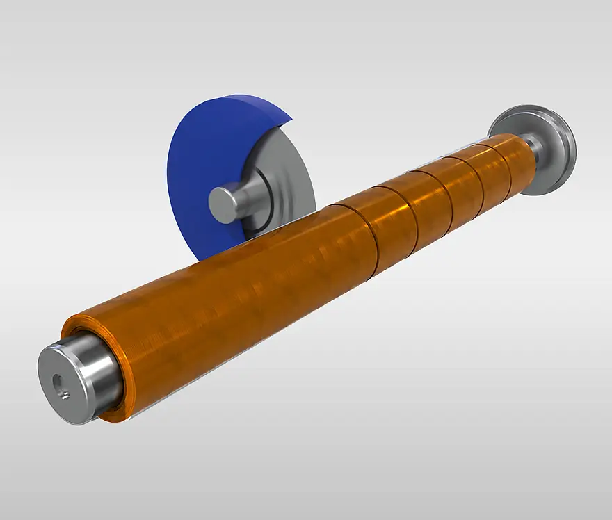 Orange film web being cut to width on a roll
