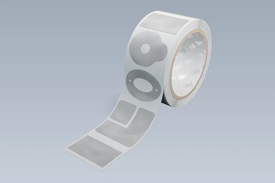 Roll of differently shaped adhesive parts illustrating possible contours