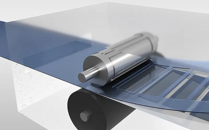 Illustration of a material web with shaped parts beneath a transparent cover