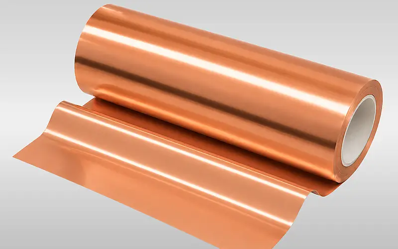 Copper-coloured metal film on a roll