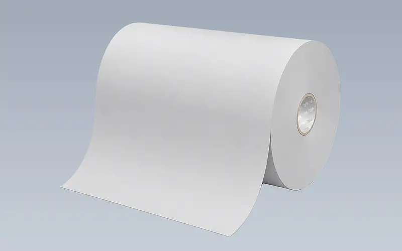 Wide white roll of starting material with an unwound web
