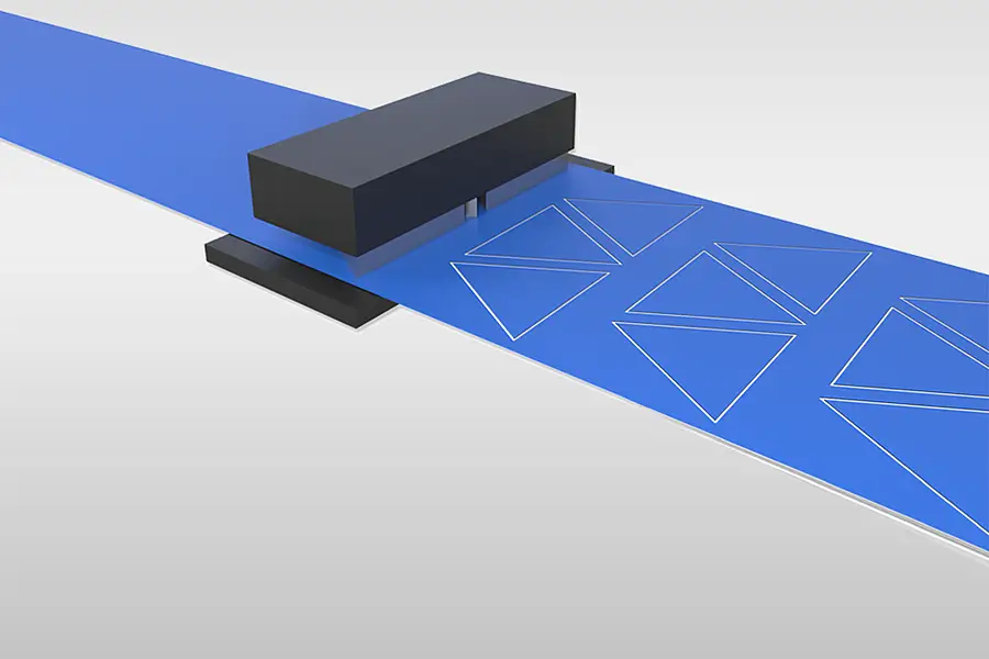 Illustration of a flatbed die-cutting tool above a material web
